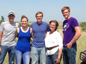 Debbie with four of her five kids, (left to right) Tyler, Allie, Eric, Debbie and Trent. Looking at Tyler and Eric now you would have any idea that one of them was sick.
