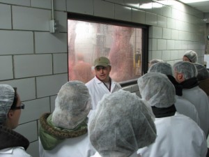 Students from R.G. Drage Careeer and Technical Center observe carcasses being processed.