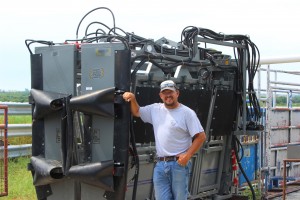 Adams with his hydraulic shoot that he saved five years to buy. This is a great tool for him and his family during the artificial insemination season.