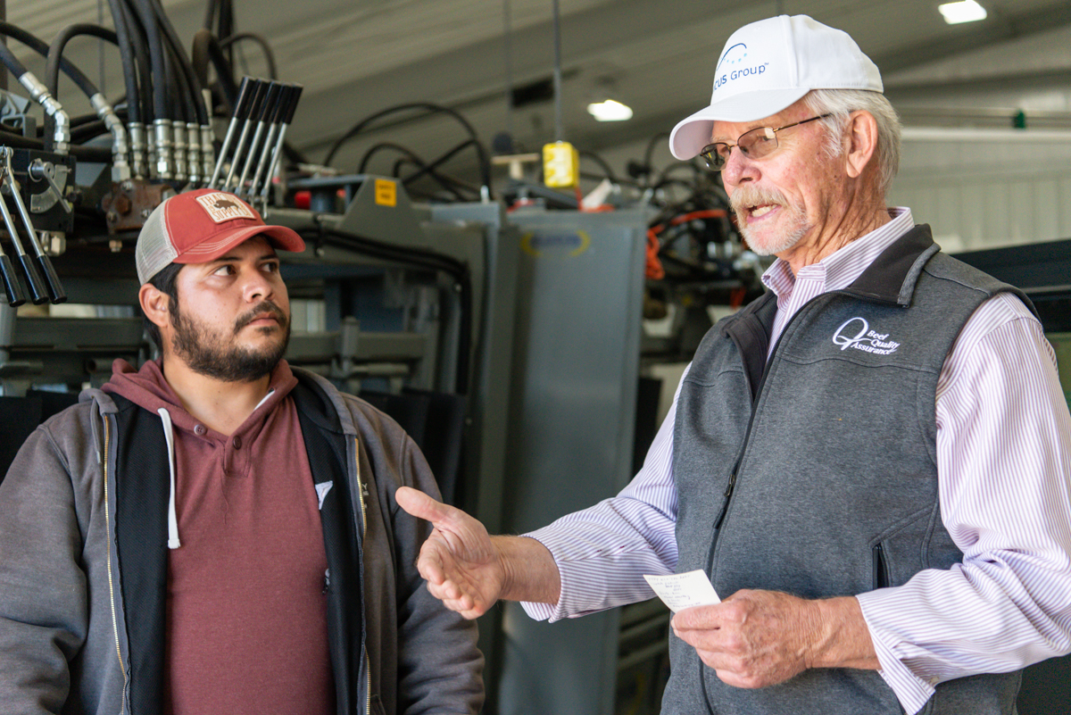 Smith explains procedures to a new veterinarian