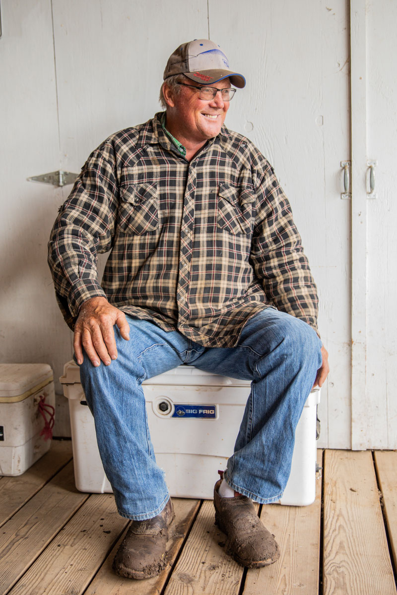 man smiling on porch